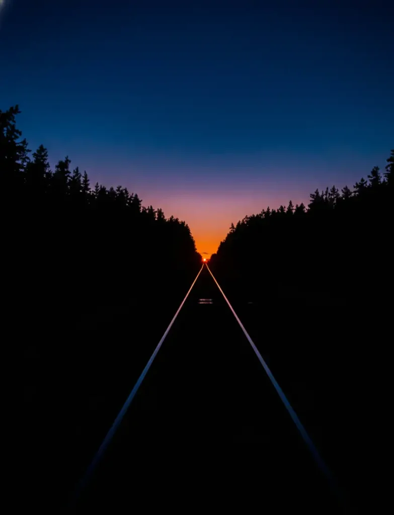 Minimal road at sunset with deep black surroundings, AMOLED black wallpaper 4K with strong contrast and dark tones