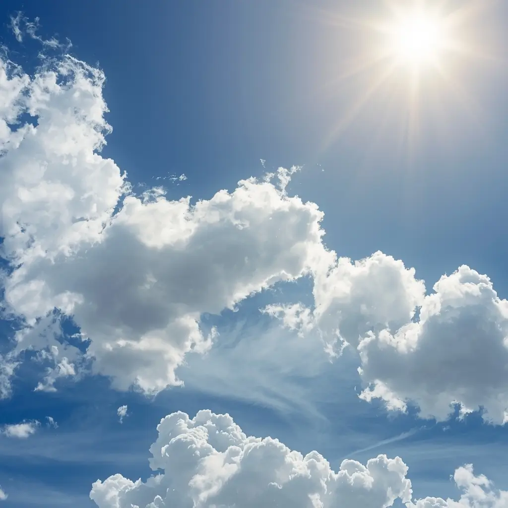 Bright blue sky with fluffy clouds and sunlight blue summer wallpaper iphone