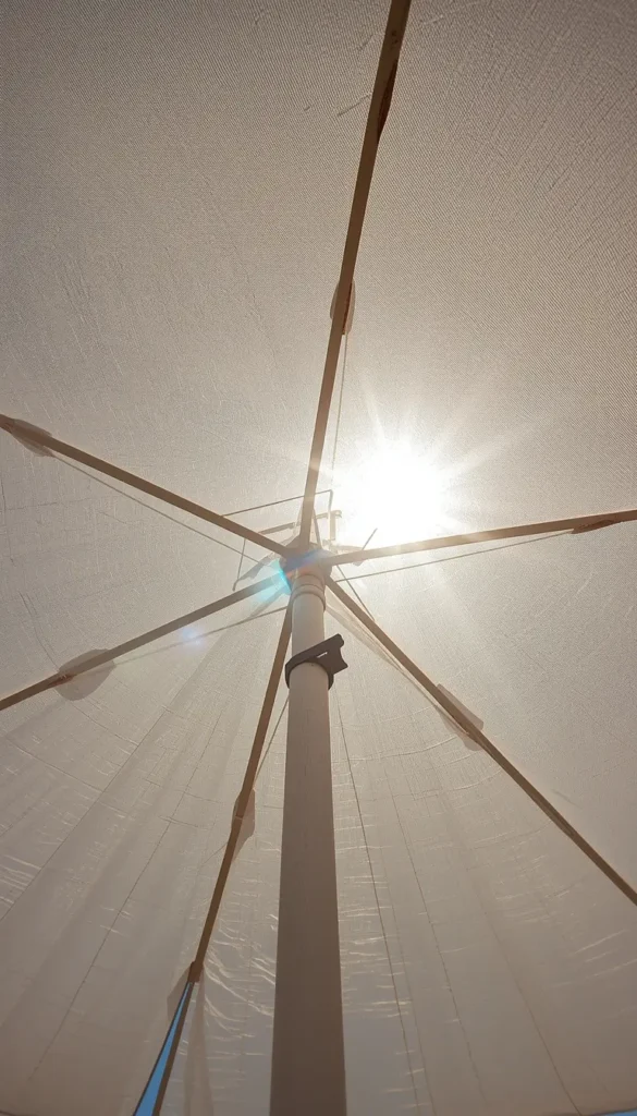 minimal beach umbrella with sunlight summer iphone wallpaper soft glow aesthetic view