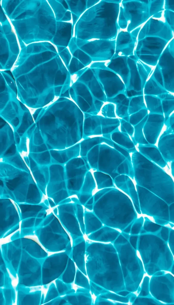 Blue swimming pool water with sunlight reflections summer iphone wallpaper