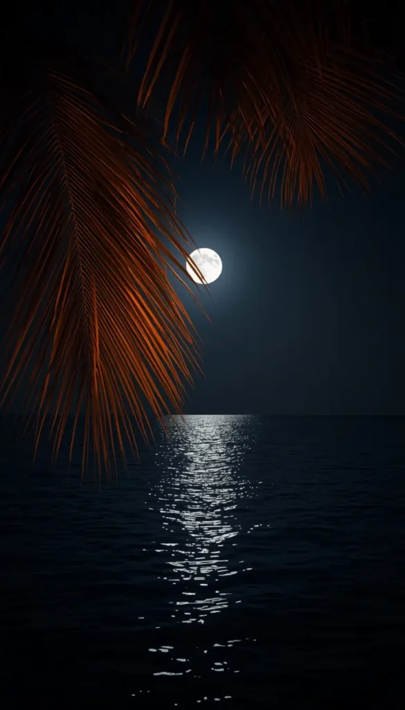 Full moon shining over a tropical ocean with palm leaves and glowing reflections on calm water.